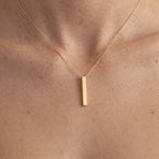 Collar obelisco dorado